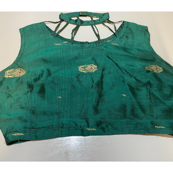 Photo of an Indian green sleeveless top with some golden embroidery